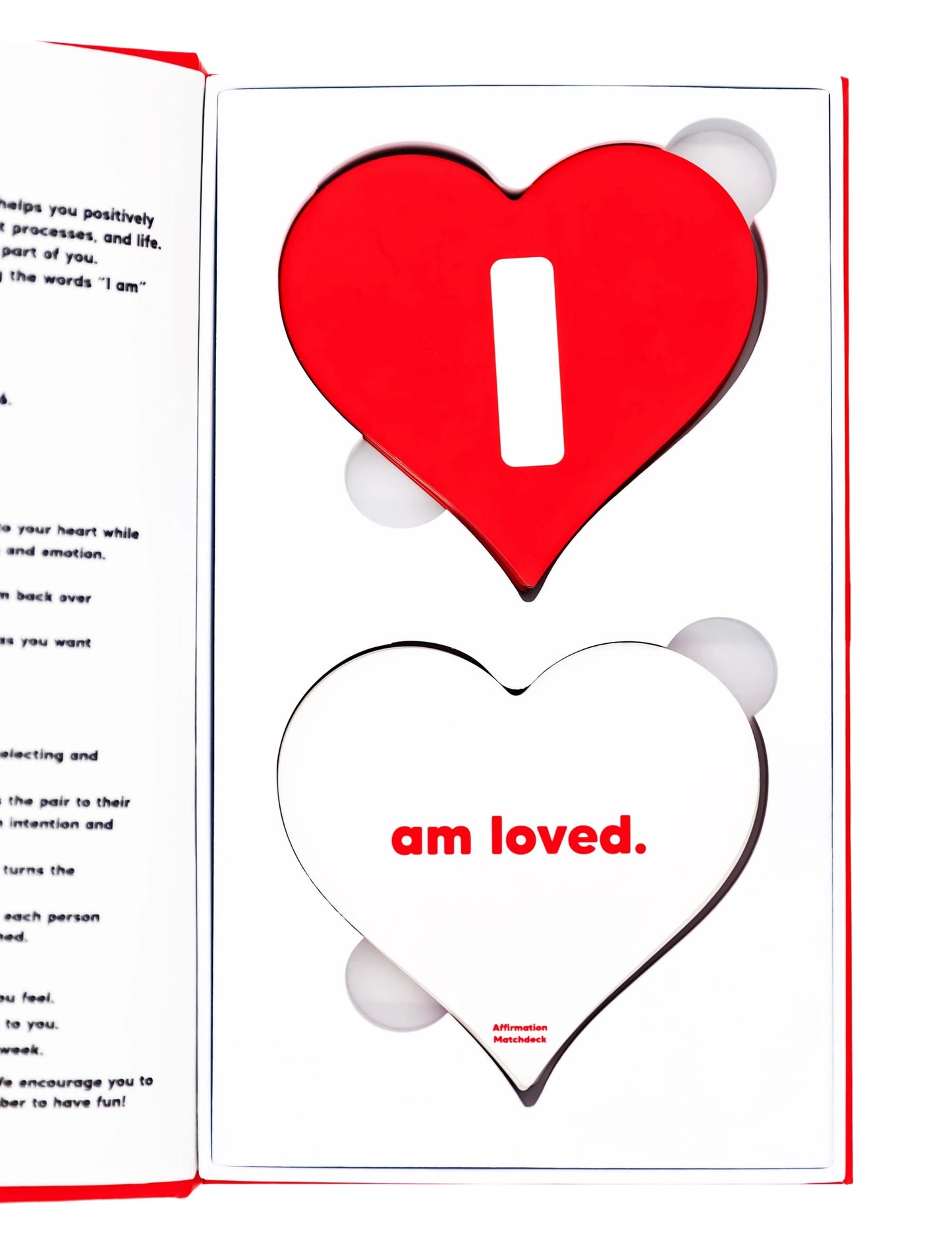 Open Affirmation Matchdeck box displaying two heart-shaped card decks with 'I' and 'am loved' text